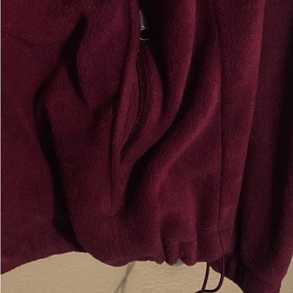 Crafted with cozy, plush fleece, zippered pockets, and a cold-blocking collar. - Picture 3 of 5